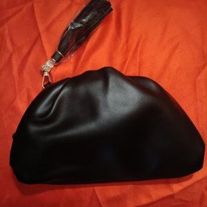 UNDERSTATED LEATHER CLITCH AND CHAIN BAG